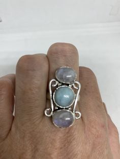 Huge blue Larimar white rainbow moonstone Lovely vintage silver setting is low content silver Size 8.5 Can be re sized for a $20 fee All rings are shipped in a nice gift box. Check out our over a THOUSAND great reviews Engraving is $4 per letter and is not always perfect depending on the piece. It can take a few days if the jeweler is busy. This is payable to Paypal Judithsltd@gmail.com Handmade Blue Moonstone Ring, Blue Moonstone Ring With Natural Stones, Unique Blue Moonstone Ring With Natural Stones, Blue Moonstone Rings With Natural Stones, Three Stone Moonstone Ring Gift, Three Stone Round Moonstone Ring Gift, Blue Moonstone Rings Perfect For Gifts, Blue Moonstone Rings As A Gift, Blue Moonstone Ring With Natural Stones As Gift