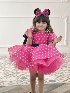 Make your little one's special day unforgettable with our charming Hot Pink Minnie Mouse Dress! Perfect for 1st birthday celebrations, photoshoots, or any occasion where you want to add a touch of magic. Features: Vibrant Hot Pink Color: Eye-catching and perfect for your little princess. Classic Minnie Mouse Design: Adorable polka dot pattern with Minnie Mouse-inspired details. Comfortable Fit: Soft and breathable fabric to keep your child comfortable all day long. Perfect for Photoshoots: Ideal 1st Birthday Photoshoot Outfit, Pink Minnie Mouse Costume, Pink Minnie Mouse Dress, Minnie Costume, Minnie Dress, Minnie Mouse Costume, 1st Birthday Photoshoot, Mouse Costume, Mouse Dress