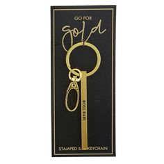 a gold keychain with the words go for god on it