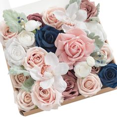 a box filled with lots of different colored flowers