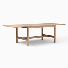 a wooden table on a white background with no one around it or the table is empty