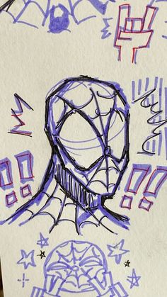 a drawing of a spider - man head on top of a piece of paper