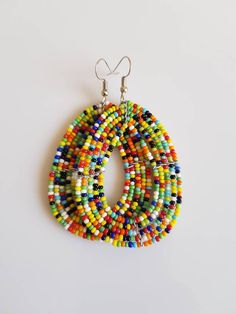 This listing is for ALL 11 pairs like shown above. The earrings are 100% handmade using original fine beads. Colorful and bright colors. ^^These earrings ships through dhl express. More earrings; https://www.etsy.com/shop/TribalTess?ref=seller-platform-mcnav&section_id=21293980 Buy multiple items and pay shipping for ONE item ONLY. Colorful Traditional Earrings, Multicolor Hoop Earrings With Large Beads As Gift, Traditional Multicolor Beaded Hoop Earrings, Unique Multicolor Beaded Hoop Earrings, Unique Multicolor Hoop Earrings With Round Beads, Handmade Multicolor Teardrop Hoop Earrings, Multicolor Round Beaded Earrings, Multicolor Large Beads Drop Earrings, Unique Colorful Round Bead Earrings