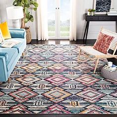 a living room filled with furniture and a colorful rug