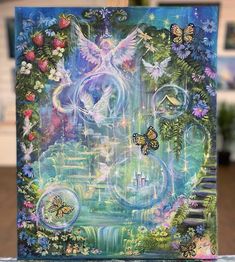 a painting with flowers and butterflies on the front, surrounded by other things in the background