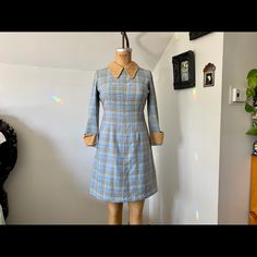 Vintage 60s Irantal Baby Blue And Tan Plaid Wool Mod Clueless Dress With Peter Pan Collar. Very Wes Anderson. Metal Zipper In Back. No Flaws On The Outside. Inside Has Some Wear, Shown In Photos, Normal For Its Age. Size 38 / Fits Like A Modern Small. Use Measurements Laying Flat: Sleeve Length 20.5 Inches Armpit To Armpit 18 Inches Waist 15 Inches Length 35 Inches #Vintage #Clueless #Mod #Wesandersonfashion #Peterpancollar Sixties Madmen Betty Draper Vintage Fitted Blue Mini Dress, Retro Blue Dress For Fall, Retro Blue Dresses For Fall, Blue Fitted Mod Mini Dress, Clueless Dress, Vintage Plaid Dress, Dress With Peter Pan Collar, Pan Collar Dress, Betty Draper