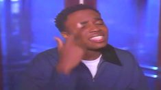 a man is making a funny face while talking on the set of tv show american idol