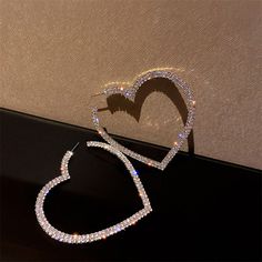 Shining rhinestone Big Heart Crystal Hoop Earrings look exaggerated, but very beautiful and shining, in line with your temperament, chic and attractive jewelry accessories for you to match the dress, work clothes, casual wear and other collocations. Metals Type: Copper AlloyGender: WomenSize (Length * Width): 45mm * 30mmStyle: TRENDYMaterial: CRYSTAL *NoteDelivery Time: Due to the current global crisis (COVID-19), shipping time may be delayed. Statement Hoop Earrings, Heart Hoop Earrings, Heart Crystal, Crystal Hoop Earrings, Dope Jewelry, Heart Shaped Earrings, Rhinestone Heart, Girly Jewelry, Big Heart