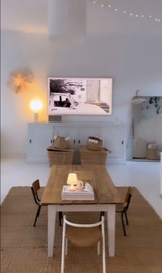 a dining room table with two chairs around it