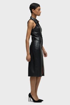 Description Our Halter Utility Dress in Black Illusion vegan leather features a midi length and sleeveless cut. Button front closure, pointed collar and front patch pockets finish the look. Product Details Body Length: 42.5", Chest: 32.5"Model Height 5'9"Model wearing size SMeasurements based on size S Fit & Care Content: 100% PolyurethaneMachine wash cold with like colorsDo not bleachTumble dry low or hang to dry Leather Midi Dress For Work, Leather Midi Dress For Night Out, Sleeveless Midi Dress With Button Closure For Date Night, Chic Leather Midi Dress For Workwear, Sleeveless Buttoned Midi Office Dress, Elegant Leather Dresses With Button Closure, Utility Dress, Kick Flares, Denim Branding