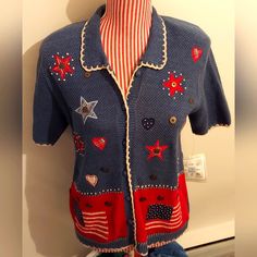 This Sweater Is Rare To Find In New Condition With Tags. It Is Vintage With A United States, 4th Of July Theme! This Sweater Is A Size Small And Buttons Down The Front. There Are Knitted And Buttons Embellishments! No Smoking Or Pets In The Home. This Was Stored In A Cedar Closet. Cross-Listed! I Will Review Reasonable Offers! Patriotic Blue Tops For Fall, Blue Short Sleeve Winter Sweater, Blue Fitted Short Sleeve Sweater, Retro Blue Knit Top, Blue Retro Knit Tops, 4th Of July Theme, Sweaters Vintage, Blue Drapes, Cedar Closet