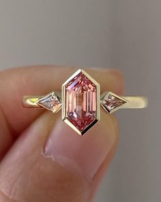 4.00 CT Peach Pink Hexagon Cut Moissanite Engagement Ring/ 14K Solid Gold Three Stone Ring/ Promise Bezel Ring For Her/ Proposal Bridal Ring Ring | Engagement Ring | Art Deco Ring | Vintage Ring | 925 Silver Ring | Moissanite Ring | Diamond Ring | Anniversary Ring | Wedding Band | Art Deco | White Gold Ring | Promise Ring | Estate Ring | Hexagon Cut | Hexagon Cut Diamond Ring | Hexagon Cut Engagement Rings | Hexagon Cut Ring | Hexagon Diamond | Hexagon Diamonds For Sale | Hexagon Cut Moissanite | Hexagon Cut Moissanite Ring | Hexagon Ring | Hexagon Cut Diamond Ring ✥ 𝐌𝐚𝐢𝐧 𝐒𝐭𝐨𝐧𝐞 𝐃𝐞𝐭𝐚𝐢𝐥𝐬 ↬ Shape: Hexagon Cut ↬ Type: Moissanite ↬ Weight: 4.00 CT (App.) ↬ Dimension: 11*7 MM(App.) ↬ Color: Peach Pink ↬ Clarity: VVS-VS ↬ Making Process: Handmade - Crafted by our experienced team Pink Moissanite Engagement Ring, Pink Moissanite Ring, Bezel Set Engagement Ring, Hexagon Diamond, Bezel Set Ring, Pink Sapphire Ring, Bezel Ring, Diamond Anniversary Rings, Moissanite Ring