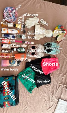 the contents of a bed spread out on top of each other, including clothing and shoes