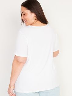 v-neck short sleeves relaxed fit hits below waist models are approx.  5'9" and wear sizes s (4), l (12) and xl (18)Machine wash cold, tumble dry low.  spandex 5% rayon 95% White Cotton Short Sleeve V-neck Top, Casual White V-neck Short Sleeve Top, White Relaxed Fit V-neck Top, White Relaxed Fit V-neck Short Sleeve Top, Relaxed Fit V-neck Graphic Tee, Casual White Relaxed Fit V-neck Top, White Cotton V-neck Short Sleeve Top, White Cotton V-neck Top With Short Sleeves, Relaxed Fit Short Sleeve V-neck Top For Summer