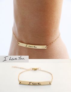 "This bracelet is the is the perfect heirloom piece. A bar charm is laser engraved with your handwriting for the perfect keepsake. Bar charm is stainless steel and plated in 18K gold. Bracelet requires little to no maintenance because stainless steel does not tarnish. Back of bracelet has three loops for attachment at 6\", 6.5\" and 7\". Details * Material - stainless steel * Bar measures 4mm by 35mm * total bracelet length is 7\" with clasp at 6\", 6.5\" and 7\" for the perfect fit. After you c Engraved Meaningful Bracelets For Valentine's Day, Minimalist Engraved Text Bracelet For Gift, Minimalist Engraved Charm Bracelet For Friendship, Meaningful Engraved Name Bracelet, Minimalist Engraved Charm Bracelet For Personalized Gift, Minimalist Engraved Charm Bracelet As Personalized Gift, Minimalist Hand Stamped Name Bracelet As Gift, Stainless Steel Laser Engraved Bracelets As Gift, Laser Engraved Stainless Steel Bracelets For Gift