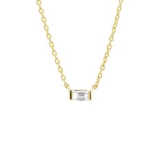 A baguette diamond set within a gold bar at the center of a gold chain. * Crafted with 14k solid gold * Diamonds: High Quality G Color, SI clarity * Available Gold Colors: 14k Rose Gold, 14k Yellow Gold, 14k White Gold * Total Diamond Carat Weight: 0.09 * This item is made-to-order and ships within 2 weeks of placing the order Baguette Diamond Necklace, West New York, Gold Colors, Diamond Carat, Gold Bar, Diamond Set, Baguette Diamond, Gold Chain, Pendant Necklaces