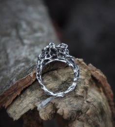 Experience the artistry of this unique handmade silver flower ring. Crafted with sterling silver, this original work embodies a natural motif, with the flower delicately supported by a whole tree root system. The design beautifully captures the roots reaching for the flower, creating a captivating and symbolic representation. The entire ring is embossed, giving it a vibrant and lifelike appearance, while maintaining a smooth and comfortable feel. The blackening of the silver in the depths of the Nature-inspired Freeform Silver Jewelry, Hand Cast Sterling Silver Nature-inspired Rings, Nature-inspired Hand Cast Sterling Silver Rings, Hand Forged Sterling Silver Rings In Nature-inspired Style, Hand Forged Sterling Silver Nature-inspired Rings, Nature-inspired Hand Forged Sterling Silver Rings, Handmade White Gold Nature-inspired Rings, Handmade White Gold Rings With Nature-inspired Style, Handmade Nature-inspired White Gold Rings