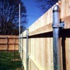 a wooden fence with a metal pole attached to it