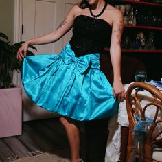 This Vintage Deadstock Marshall Fields Party Dress From The 80s Makes A Big Statement. Boasting A Teal Bottom And A Black Sequin Bodice, It's Sure To Turn Heads. Perfect For Your Holiday Festivities And Never Worn, This One-Of-A-Kind Piece Is A Must-Have! *Size: 30 Bust , 32 Waist Material: 55% Acetate ,30% Polyester, Skirt - 100% Acetate 80s Prom Dress Ideas, Vintage 80s Clothes, Retro Holiday Party Dresses, 80s Bridesmaid Dress, 80 Prom Dresses 1980s, Early 2000s Prom Dress, 80’s Prom Dress, 80s Dresses Party, 80s Prom Dress Costume