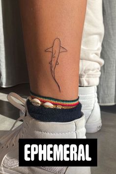 a person's foot with a tattoo on it and the words ephemeral