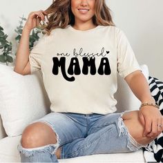 Blessed Mama Shirt, Mom Gift, One Blessed Mama Shirt, Mom Crew, Best Mom Shirt, Blessed Mom Shirt, Gift For Mom, Mothers Day Gift BLACK TEXT is used for Yellow, Heather Peach, White, Light Gray Heather, Mint, Pink Shirts. Other colored shirts have white text. F I T ∙ & ∙ S I Z I N G : -->Women's sizes are narrower than the waist. -->Sleeves are rolled up in some product pictures. They do not come rolled up on delivery. T I M E ∙ T O ∙ D E L I V E R Y : -->Processing and production time is 1-2 business days. I M P O R T A N T ∙ P L E A S E ∙ R E A D ∙ F U L L Y : --> Order cancellations are accepted for 2 hours after purchase. -->For any questions, please contact me directly. It's my pleasure to a Orders placed till 12 noon are shipped the next business day and those placed after 12 noon ar Blessed Mama Shirt, Pink Shirts, Boy Mama, Blessed Mama, Nicu Nurse, Mama Gifts, Mom To Be, Spring Vibes, Product Pictures