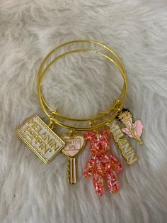 2 piece pink, white, and gold charm bangle set! Pink Charm Bangle Jewelry, Pink Bangle With Charms, Pink Dangling Charms For Friendship, Pink Metal Charm Bangle Bracelet, Cute Pink Bangle Charm Bracelet, Personalized Pink Bangle Charm Bracelet, Cute Gold Bangle Jewelry, Trendy White Bangle For Gift, Trendy White Bangle As Gift