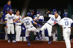 some baseball players are running on the field