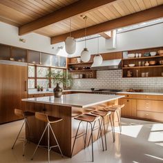 a large kitchen with wooden cabinets and white counter tops, along with bar stools