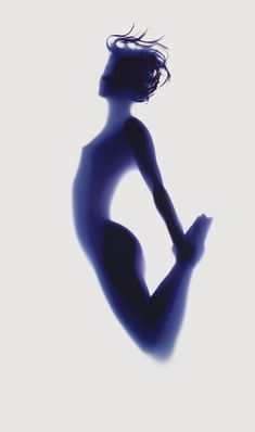 the silhouette of a woman is shown against a white background with blue light coming from behind her