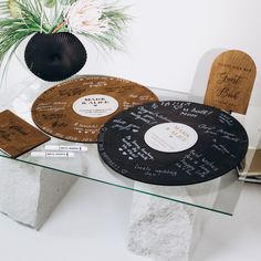 a glass table topped with different types of discs