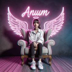 a woman sitting in a chair with an angel wing on it's back and the word annum above her head