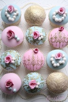 cupcakes decorated with pink and blue frosting