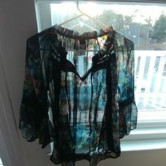 Sheer Oversized Small, Black Floral Print Blouse/Tunic. Never Worn. Approximate Measurements Are Bust 23 Inches Length. Is 27 At The Longest Point. Longer Backside Than The Front. Casual Multicolor Sheer Tops, Black Summer Blouse For Beach, Black Floral Print Vacation Blouse, Black Spring Vacation Blouse, Black Tunic Top For Spring, Casual Black Flowy Blouse, Chic Black Blouse For Vacation, Black Sheer Beach Top, Chic Black Vacation Blouse