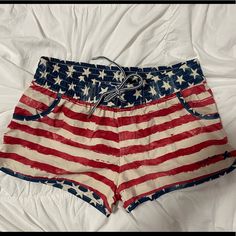 Cream,Red, And Navy American Flag Shorts. 100% Polyester. Waist -13 Inches Across Inseam -1.5 Casual Beach Shorts With Flag Print, Casual Flag Print Bottoms For Beach, Casual Beach Bottoms With Flag Print, Casual Bottoms With Flag Print For Beach, Casual Beach Bottoms For 4th Of July, Casual Beach Shorts For 4th Of July, Casual Shorts For 4th Of July Beach, Beach Shorts With Flag Print, Summer Vacation Flag Print Bottoms