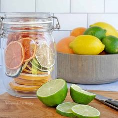 there are lemons, limes and oranges in the jar