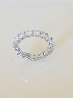 4 TCW 925 Sterling Silver Round Cut 4 mm CZ Prong Eternity Bridal Ring Band Size 4-11 by shopcelebritystyles on Etsy Dazzling Eternity Band With Prong Setting, Dazzling Round Eternity Band With Prong Setting, Promise Ring Eternity Band With Prong Set Moissanite, Moissanite Eternity Band With Prong Setting For Promise Ring, Lab Grown Diamond Eternity Band With Prong Setting, Dazzling Lab-grown Diamond Eternity Band, Prong Setting Diamond White Eternity Band, Classic Silver Cubic Zirconia Eternity Band, Diamond White Round Cut Eternity Band With Prong Setting