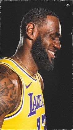 a close up of a person with a beard and tattoos on his chest wearing a lakers jersey