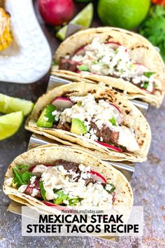 mexican steak street tacos are lined up on a counter