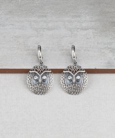 Wise Owl Dangle Drop Earrings 925 Sterling Silver with Clear Cubic Zirconia CZ Gemstones Artisan Crafted Vintage Inspired Material: 925 Sterling Silver Clear Cubic Zirconia CZ Gemstones Earrings Length: 1.60 inches Width: 0.90 inches Closure: Lever back Matching pendant is available https://www.etsy.com/listing/1027110377/wise-owl-pendant-necklace-925-sterling?ref=listings_manager_grid Comes with a gift pouch and box Free Domestic Shipping It is a gift that will create memories for years to come Cubic Zirconia Filigree Jewelry Gift, White Gold Sterling Silver Crystal Earrings For Gift, Silver Cubic Zirconia Crystal Earrings For Gift, Silver Diamond Filigree Earrings Gift, Silver Sterling Silver Pierced Diamond Earrings, Sterling Silver Diamond Earrings With Ear Wire As Gift, Silver Diamond Drop Earrings With Ear Wire, Sterling Silver Dangle Diamond Earrings Gift, Sterling Silver Pierced Diamond Earrings As Gift