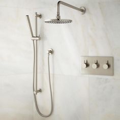 a shower head and hand shower with thermostaer attached to it's side