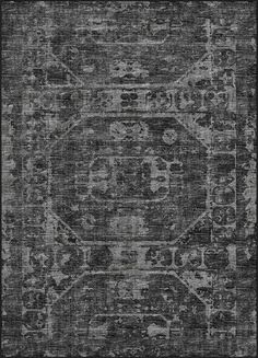 a black and white rug with an intricate design on the bottom, it is very dark