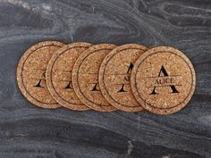 six cork coasters with the initials on them