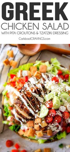 this greek chicken salad has lettuce, tomatoes, cucumbers and dressing