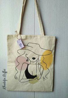 a tote bag with a drawing of a woman wearing a hat