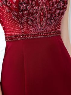 the back of a woman's dress with beading and sequins on it