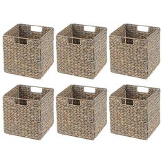 four baskets with clothes in them sitting next to each other