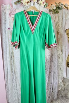 "Beautiful Vintage 70s green long maxi dress with a colorful striped v-neck and butterfly sleeves. The Dress is a unique piece that is vibrant and groovy, can be styled with cute sandals for spring/summer..etc.  Pre Loved Good Vintage Condition No Stains or Holes Note: I noticed the dress has several little snags on the back bottom of the dress and a slight one at front, not too noticeable only if you look closely. This dress is still beautiful even if it has flaws, remember is vintage from the Green V-neck Lined Maxi Dress, Retro V-neck Lined Maxi Dress, Spring Vintage V-neck Maxi Dress, Vintage V-neck Maxi Dress For Spring, Retro V-neck Maxi Dress For Spring, Vintage Green V-neck Maxi Dress, Retro Summer Maxi Dress With V-neck, Green Vintage V-neck Maxi Dress, Retro Green Long Sleeve Maxi Dress