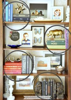 a bookshelf filled with lots of books and pictures