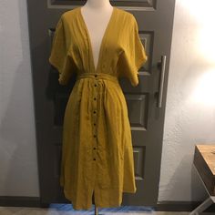 Plunging V-Neck With Button-Up Midi. Color Is A Beautiful Mustard Gold. Fabric Is Opaque, Drapes Beautifully, And Is Light Enough For A Hot Summer. Basically New Without Tags (Worn Twice) Reposhing This Item I Purchased From @Heft6129. Loved It, But Ready To Rotate For Something New. Questions? Leave A Comment Below! Summer V-neck Shirt Dress With Buttons, Spring V-neck Midi Dress With Buttons, V-neck Maxi Dress With Button Closure For Daywear, Fitted V-neck Shirt Dress For The Beach, Yellow V-neck Dress For Casual Wear, V-neck Shirt Dress With Button Closure For Casual Wear, V-neck Shirt Dress With Button Closure, Summer V-neck Dress With Buttons, V-neck Midi Dress With Button Closure For Vacation