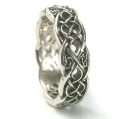 a silver ring with an intricate design on it